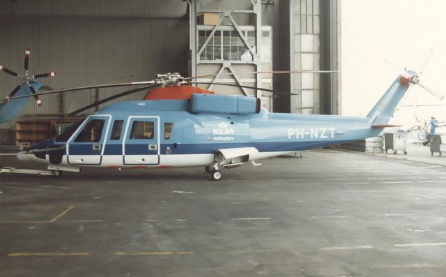 PH-NZT — - De in 1986 gebouwde Sikorsky S-76B Eagle c / n 760326 werd op 18 december 1986 in Nederland geregistreerd als PH-NZT door KLM Helikopters BV, Schiphol-Oost. Het vliegtuig werd voornamelijk gebruikt op offshore vluchten, eerst vanaf Amsterdam Airport Schiphol , later uit Den Helder-de Kooy. Op 12 oktober 1993 veranderden naam en eigendom in KLM / ERA Helicopters BV., Schiphol-Oost. Op 22 februari 1996 werd de registratie PH-NZT geannuleerd en dezelfde dag werd de S-76B geregistreerd als G-UKLT in het VK bij KLM ERA Helicopters (UK) Ltd. In 1998 werd KLM ERA Helicopters geïntegreerd in Schreiner Northsea Helicopters BV en De S-76B G-UKLT is geregistreerd bij deze nieuwe operator. Op 15 juli 1998 registratie G-UKLT is geannuleerd en de volgende dag is registratie PH-NZT hersteld bij Schreiner Northsea Helicopters BV, Den Helder. Op 4 september 2002 is de geregistreerde eigendom van de helikopter gewijzigd in Capital Aviation Services BV., Hoofddorp, met Schreiner Northsea Helicopters BV te Den Helder als houder. In 2005 werd Schreiner Northsea Helicopters geïntegreerd in CHC Helicopters en sindsdien wordt de PH-NZT beheerd door CHC Nederland. Op 24 april 2006 werd Sikorsky PH-NZT geregistreerd bij CHC Helicopters Netherlands BV, Den Helder, als operator en Capital Aviation Services BV., Hoofddorp, als eigenaar. De helikopter was tot 12 december 2012 gestationeerd op Den Helder-De Kooy. Die dag verlieten Sikorsky S-76B PH-NZT en PH-NZU Den Helder over de weg naar Zeebrugge in België. Vanuit de haven van Zeebrugge werden de helikopters verscheept naar Boundary Bay, Canada. Op 18 juli 2014 is de registratie PH-NZT door de IVW doorgehaald omdat de helikopter langer dan een jaar zonder CofA was.