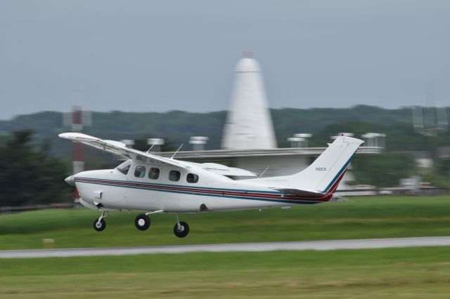 Cessna P210 Pressurized Centurion (N92CK) - The wing catches a gust of wind while Departing Runway 23 at FDK from AOPA Fly-In Saturday 5-11-2019 as rain showers began to near