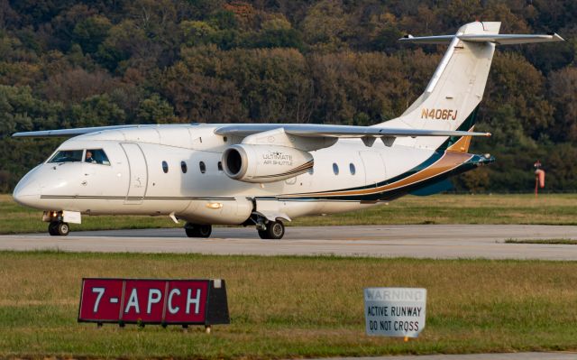 Fairchild Dornier 328JET (N406FJ) - Ultimate 6 taxiing by as it prepares to depart to Oklahoma.