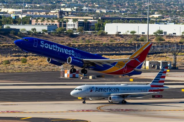 Boeing 737-800 (N8303R) - Southwest Airlines 737-800 taking off from PHX on 9/17/22. Taken with a Canon 850D and a Canon EF 70-200mm f/2.8L IS II USM lens. 