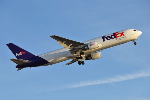 BOEING 767-300 (N154FE) - 23-L Departure on 11-19-20 during golden hour.