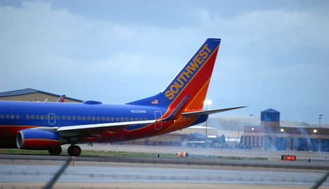 Boeing 737-700 (N232WN) - Blowing some water