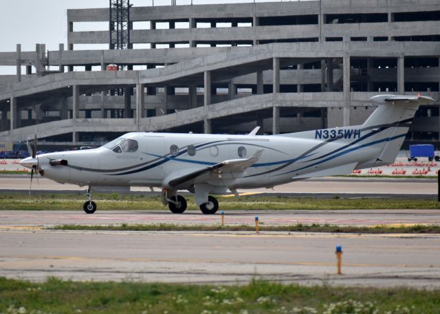 Pilatus PC-12 (N335WH) - The new $208 million Love Field parking garage under construction in the background.