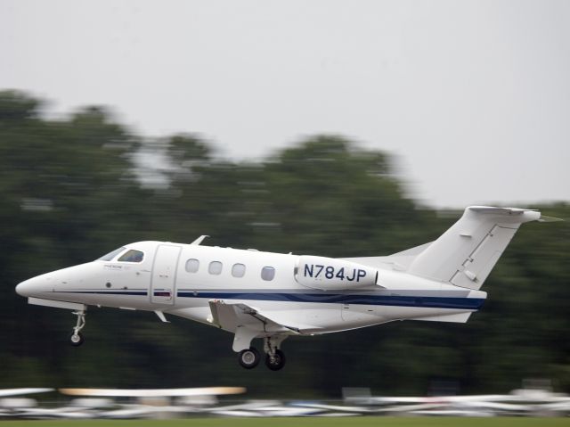 Embraer Phenom 100 (N784JP) - Take off runway 26.