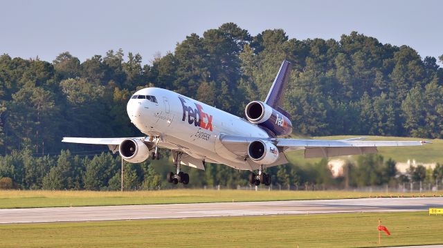 McDonnell Douglas DC-10 (N381FE) - FedEx MD10 N381FE touching down on 23R on 9/21/14.  Taken from the RDU Observation Deck.