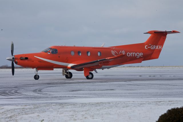 Pilatus PC-12 (C-GRXH) - One of the regular air ambulance visitors to Kingston from Ornge...  sitting on the apron covered with snow for the first time this year