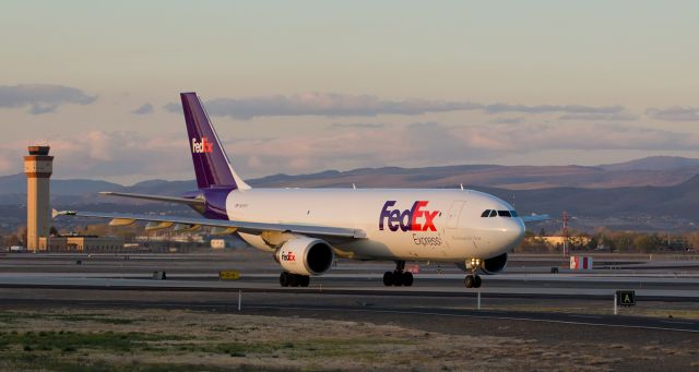 Airbus A300F4-600 (N669FE) - I normally only post one pic a day but since I was "out of service" for over a week I figured Id post two snaps today.  So here is my second one of the day ... another Fed Ex bird. br /The sun has slipped down behind the Sierra Nevadas but there was still enough sunset light shining on Fed Exs "Kaitlyn" to get this snap of N669FE as it taxied south along Alpha for a 7:09 PM departure from runway 34L to begin the return half of a KMEM-KRNO-KMEM turnaround trip.  The sundown light made for a beautifully colored capture.