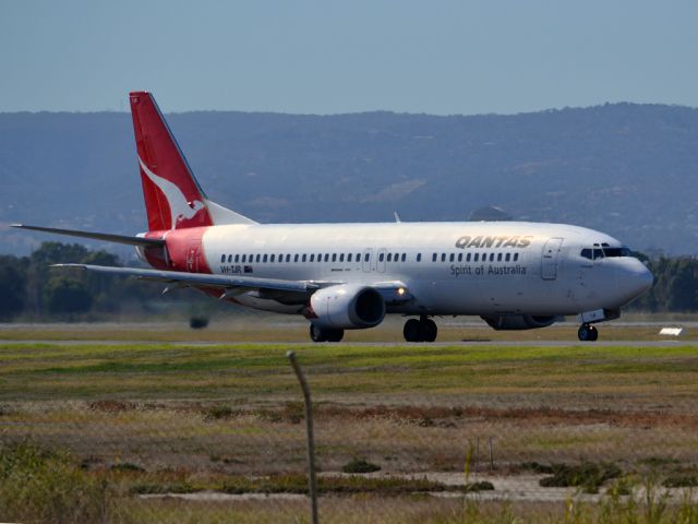 BOEING 737-400 (VH-TJR) - A Qantas old girl on taxi-way heading for take off on runway 05. Thursday 12th April 2012.