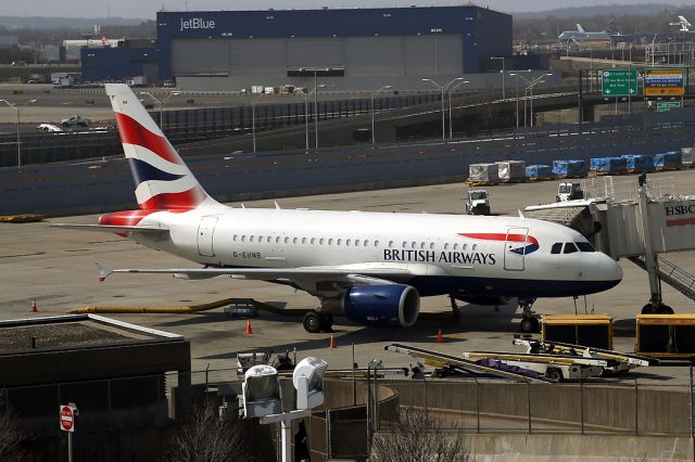 Airbus A318 (G-EUNB) - Seen from the Airtrain at JFK. 13 April 2014