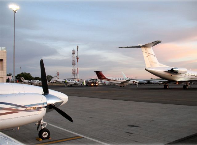 Beechcraft Baron (58) (ZS-MDJ) - 6 a.m. at Lanseria, South Africa. The typical carter fleet consists of King Airs, Barons, C402 and some GLF2s.