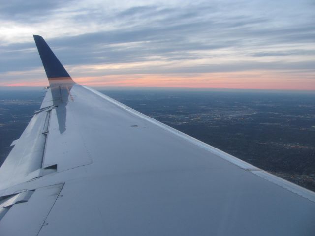 Embraer EMB-145XR — - Sunset Approach into OHare.