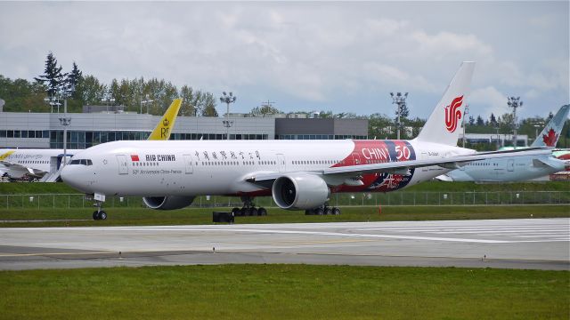 BOEING 777-300 (B-2047) - BOE169 waits on taxiway A to make a fast taxi / brake test on Rwy 16R after its flight test on 4/24/14. (LN:1196 / cn 60374). (Seemed like a view of the port side of the aircraft would be nice).