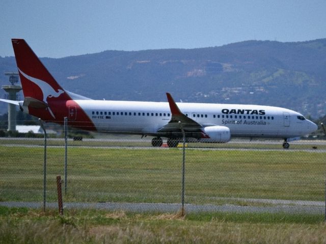 Boeing 737-800 (VH-VXE) - On taxi-way heading for take off on runway 05.