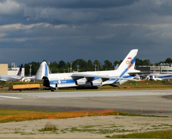 Antonov An-12 (RA-82081) - Note: Aircraft "Kneeling" to assist offloading cargo