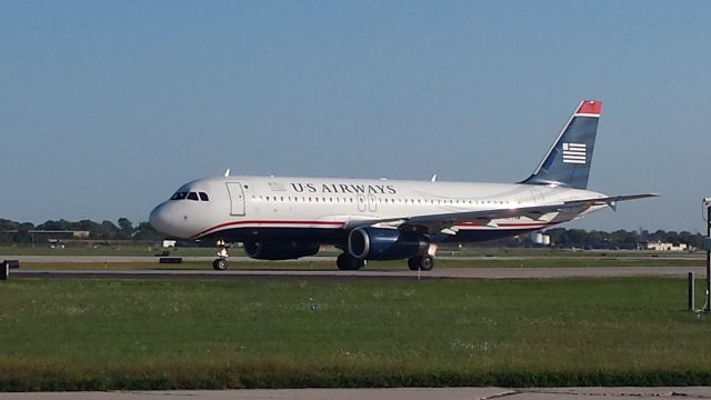 Airbus A320 (N677AW) - Another A320 (originally delivered 6/5/05) that followed the America West Airlines-US Airways-American Airlines lineage. This particular Airbus is flying as American Airlines in this picture, but still sporting the US Airways livery. Seen before takeoff at General Mitchell 9/14/15. 