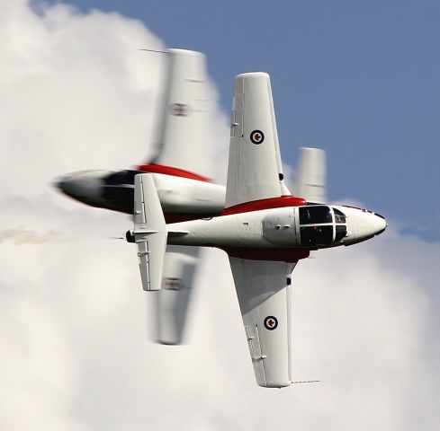 — — - Snowbird solos perform the Knife-edge cross at the 2013 Canada Remembers Our Heroes air show in Saskatoon, SK.