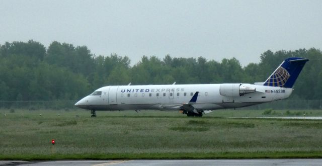 Canadair Regional Jet CRJ-200 (N652BR) - Taxiing to the gate is this 2000 United Express Canadair Regional Jet 200LR from the Spring of 2022.