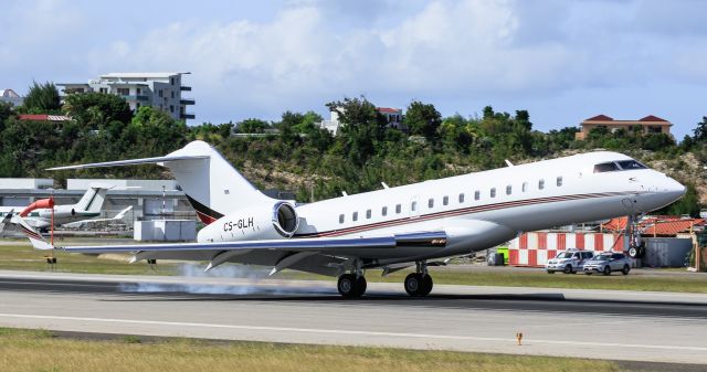 Bombardier Global Express (CS-GLH) - Bombardier Global 6000-BD-700-1A10 (CS-GLH) touching down at TNCM St Maarten while law enforcement looks on!