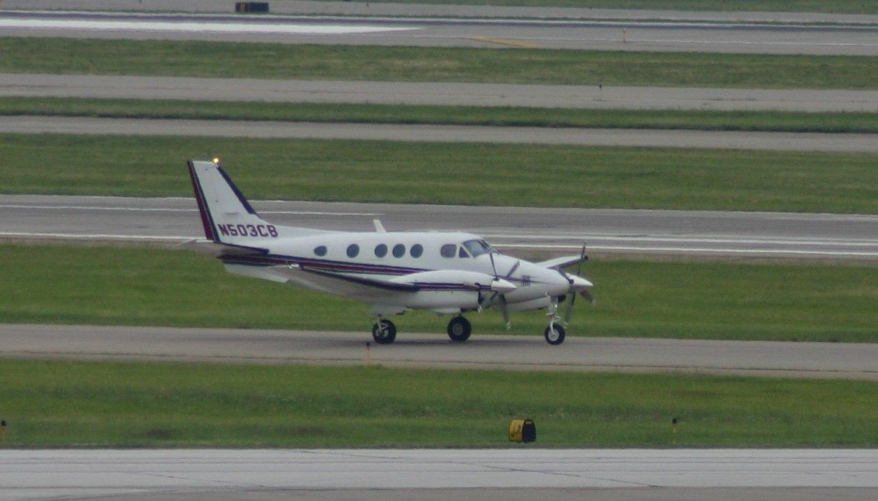 Beechcraft King Air 90 (N503CB) - Taken from the green parking garage. 