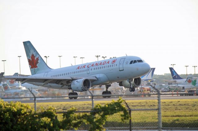 Airbus A319 (C-GBIK) - Arriving at dusk on runway 06R