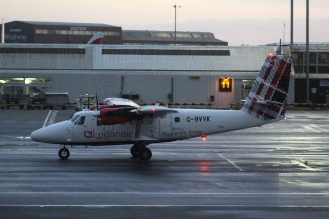 De Havilland Canada Twin Otter (G-BVVK) - A Loganair De Havilland Canada DHC-6-300 Twin-Otter pushed back at Glasgow Airport.br /br /Locaton: Glasgow Airport.br /Date: 25.11.22 (dd/mm/yy).