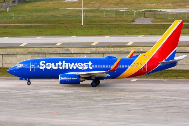 Boeing 737-700 (N7707C) - Taxiing for departure on RWY 19R. 12/2/2014.