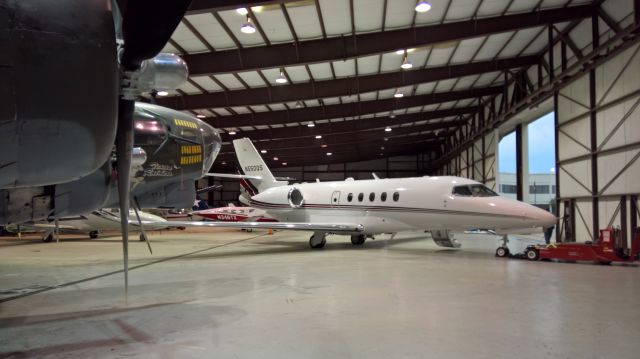 Cessna Citation Sovereign (N550QS) - Parked next to a B17