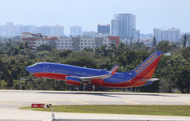 Boeing 737-700 (N260WN) - Southwest Airlines (WN) N260WN B737-7H4 [cn32518]br /Fort Lauderdale (FLL). Southwest Airlines flight WN3030 departing from runway 10R for Queen Beatrix Oranjestad/Aruba (AUA). Captured wearing Southwest’s Canyon Blue Livery introduced in 2001 and since September 2014 is being replaced by the Heart livery.br /Taken from Hibiscus/Terminal 1 car park roof level br /br /2018 12 25br /https://alphayankee.smugmug.com/Airlines-and-Airliners-Portfolio/Airlines/AmericasAirlines/Southwest-Airlines-WN/