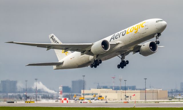 Boeing 777-200 (D-AALG) - Aero Logic 77F climbs off runway 06L bound for Houston