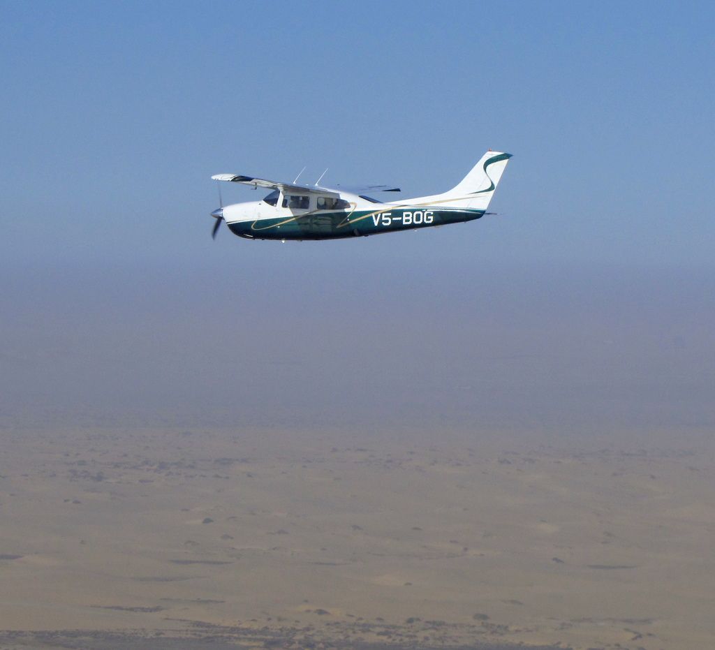 Cessna Centurion (V5-BOG) - V5-BOG flying over the Namib Desert, Namibia
