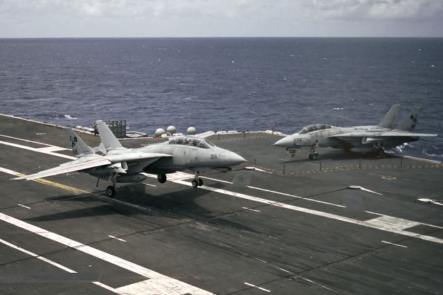 Grumman F-14 Tomcat (N211) - A Grumman F-14 Tomcat just about to snag the number 2 wire while another rests nearby. Aboard the U.S.S. Carl Vinson, CVN-70.