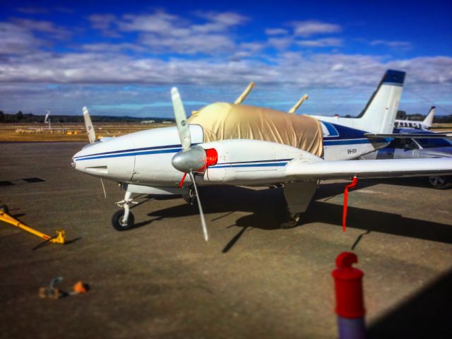 Beechcraft 55 Baron (VH-ISA) - Mark Pracys Beech Craft Barron sitting on the ground at Cessnock