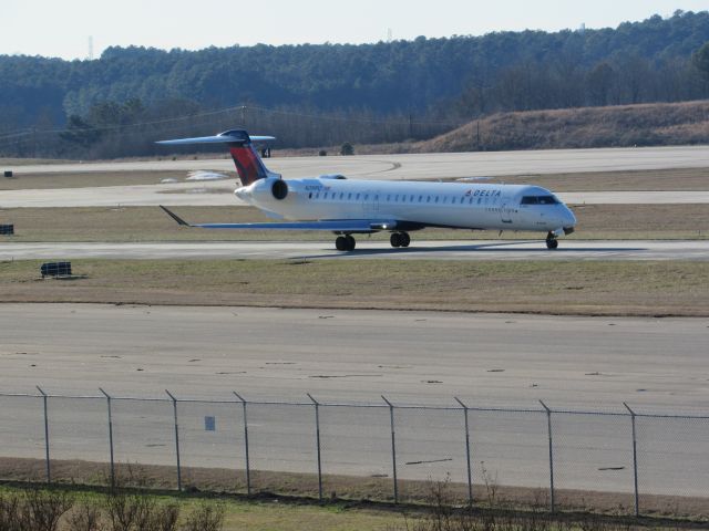 Canadair Regional Jet CRJ-900 (N299PQ) - Delta Connection (Endeavor Air) flight 3719 to La Guardia, a Bombardier CRJ900 taxiing to takeoff on runway 23R. This was taken January 30, 2016 at 4:08 PM.