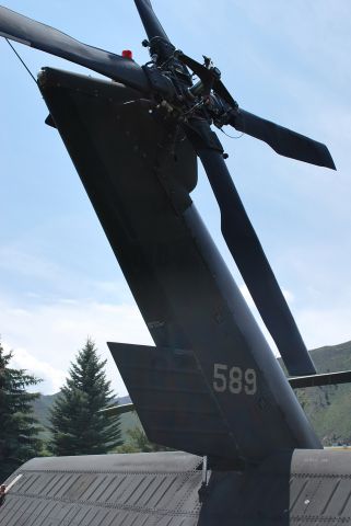 — — - Tail section of a Sikorsky UH-60 Black Hawk