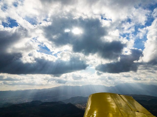 Beechcraft Sierra (N929BJ) - God's rays shinny through clouds off the right wing.