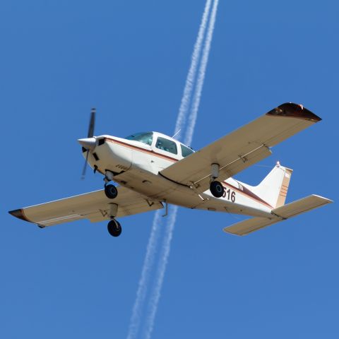 Beechcraft Sundowner (N18516) - Got lucky with this shot of a Beech C23 flying in front of a contrail from a passing jet.