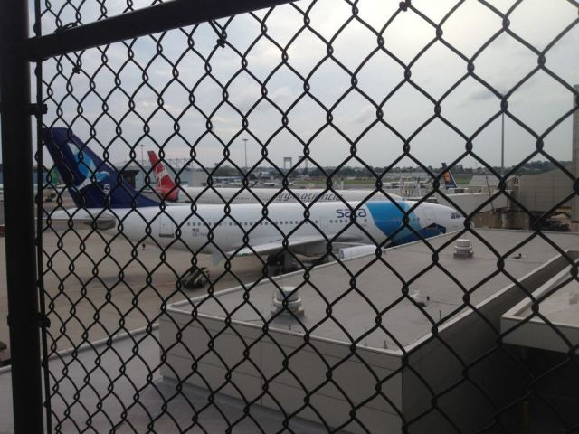Airbus A310 — - standing at the corner of the international departures terminal, plane is at E8B