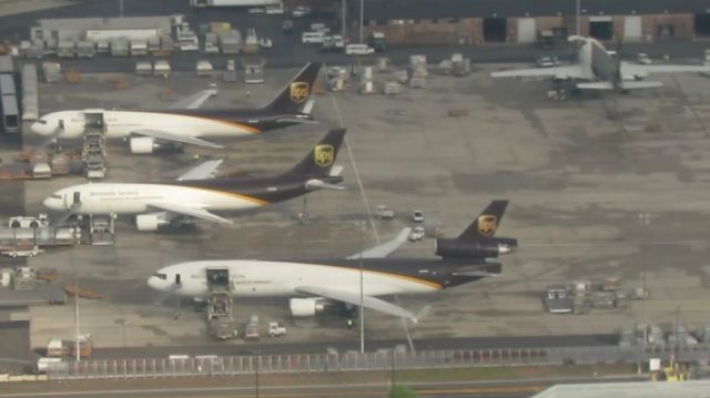 Boeing MD-11 — - UPS cargo apron at KEWR. Notice the A300F and 767-300F behind the MD-11F. I was able to get this picture as a frame from an HD video.