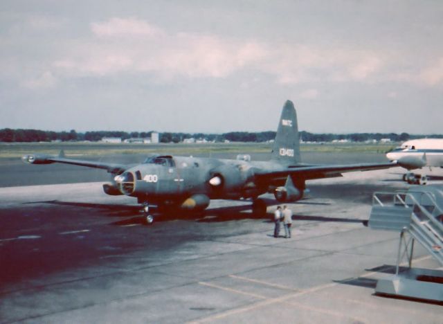 — — - While plane watching years ago at Bradley Field in Windsor Locks CT, a shabby, forlorn P-2 Neptune (note twin 50 cal. dorsal gun turret) pulled up, brakes squealing and parked between airliners. Two men came out from the terminal and talked between themselves for 5 minutes, then handed the pilot a note using a long pole. The P-2 then pulled out and took off into history. What a day that turned out to be.