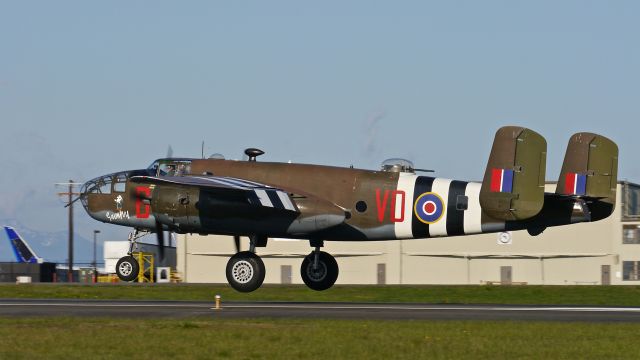 North American TB-25 Mitchell (N88972) - Historic Flight Foundations B25-D "Grumpy" nears touchdown to Rwy 34L on 4/12/14. (Ser#43-3318).