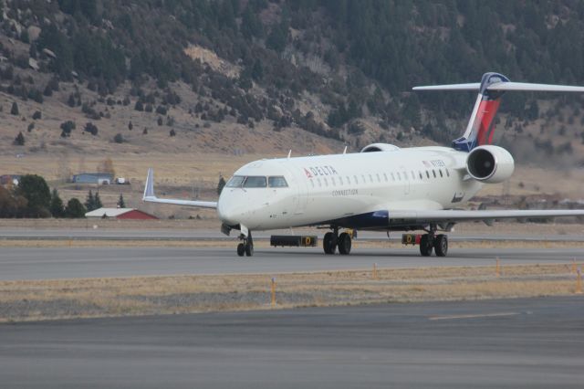 Canadair Regional Jet CRJ-700 (N713EV) - N713EV taxiing from runway 12 at Butte as SKYWEST 4312 from KSLC.br /br /Taken 17:01, November 2, 2024 with a Canon EOS T2i and 70-300mm (300mm, 1/500, ƒ7.1, ISO 800)