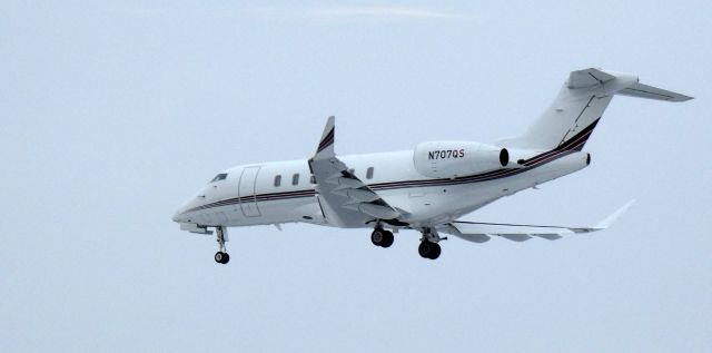 Canadair Challenger 350 (N707QS) - About to touch down is this 2019 Bombardier Challenger 350 in the Winter of 2024.