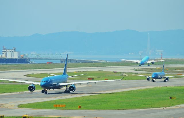 Airbus A330-200 (VN-A375) - Three blue aircraft in regular traffic operations.  Airline: Vietnam Airlines (VN/HVN); Airport: Kansai International Airport (KIX/RJBB); Camera: Nikon D7000; Date: 4 July 2012