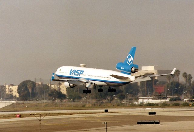 Boeing MD-11 (PP-SFA) - KLAX - PP-SFA landing 24R in March 1998 - photo taken from the overpass of Sepulveda Blvd. crummy scan from a print.