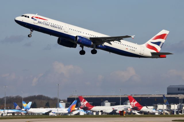 Airbus A321 (G-EUXG) - BAW1389 Shuttle flight back to Heathrow against a backdrop of the aircraft on Terminal 2.