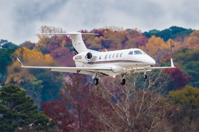 Embraer Phenom 300 (N327QS) - N327QS is a 2013 Embraer Phenom 300 seen here on final approach to Atlanta's PDK executive airport. I shot this with a Canon 500mm lens. Camera settings were 1/2000, F4, ISO 500. Please check out my other photography. Votes and positive comments are always appreciated. Questions about this photo can be sent to Info@FlewShots.com