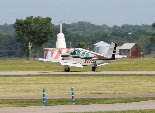 Beechcraft Bonanza (36) (N777NK) - Landing rwy 27 on 5/3/12...