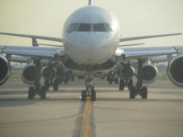 — — - A busy afternoon at Philly as planes wait their turn for a 27L departure