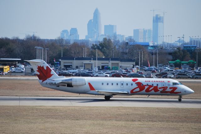 Canadair Regional Jet CRJ-200 (C-GNJA) - Taking off on runway 18C at Charlotte Douglas International Airport - Jan. 2009