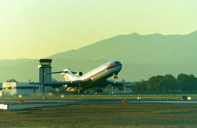 BOEING 727-200 (N7449U) - KSJC - I loved the north long term parking lot long before 30R was extended and the parking lot was moved - I am standing in the lot, adjacent to the end of the runway........I used to videotape here for weeks on end before I started work at 08:00 downtown San Jose,,,,this photo must be 06:31AM as the Chicago bound 727 rotates fully loaded close to snagging the barbed wire fences at the end of the runway........there's nothing like a 727 smokin' off the runway.....